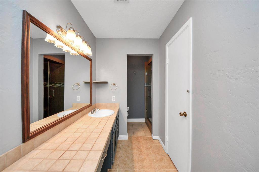 Luxurious and expansive primary bathroom, perfect for relaxation and style.