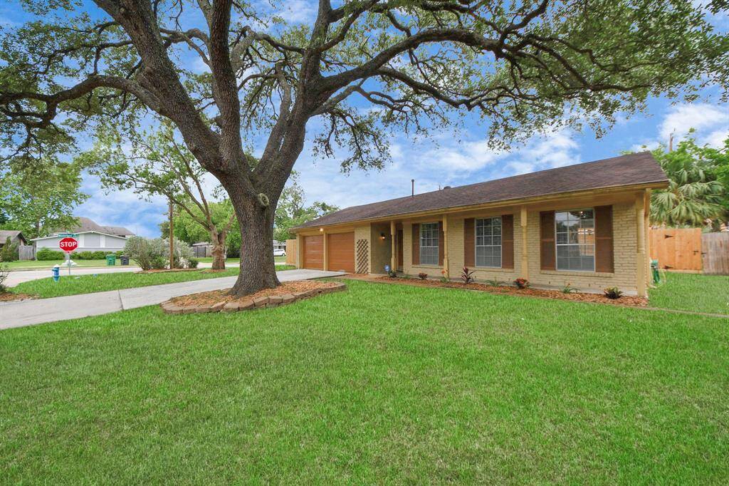 This single-story property features a recently painted two-car garage, and covered front porch—ideal for long-term tenants or future resale.