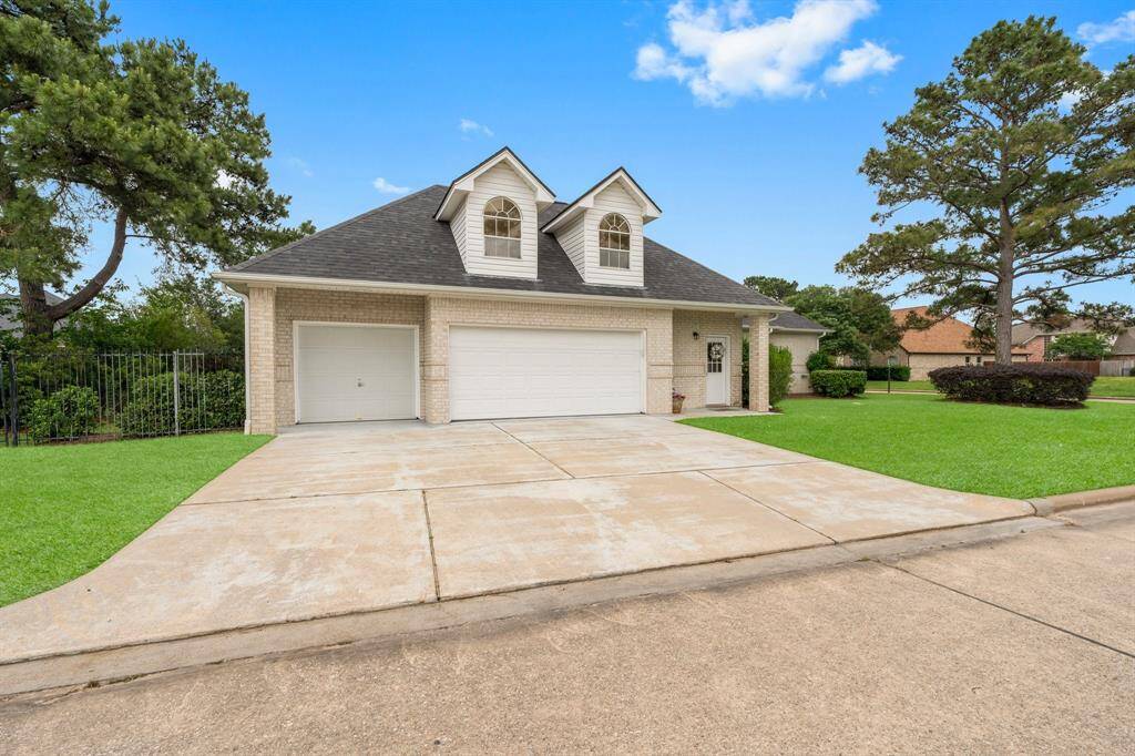 Wide 3 Car Side Driveway perfect for ideal curb appeal in front. Brand New Small Door in Jan 2025, New Larger Stall Door May 2025. Convenient side entry into utility room or straight up the stairs to the Extra room! This fully bricked home comes with a  spacious three-car garage or 2 and a Golf Cart Garage; you choose! Pleney of room for guest parking!