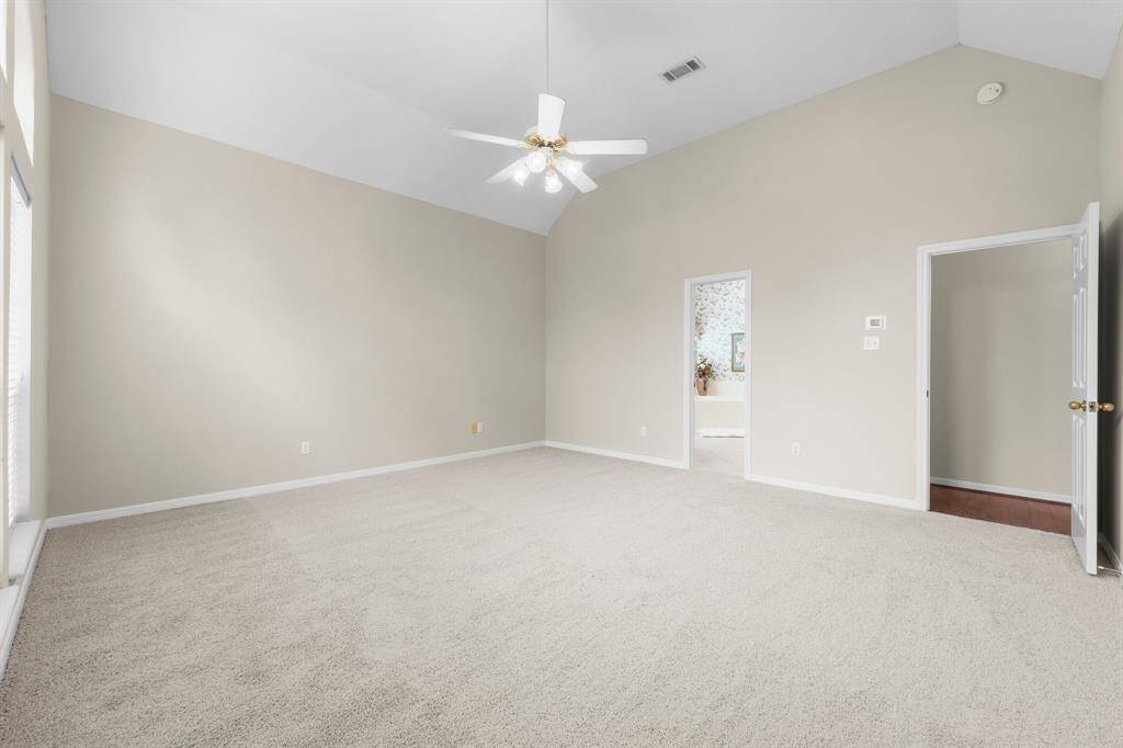 Primary Retreat, Fresh Paint & New Carpet featuring high ceilings and a ceiling fan. This room is controlled by a recent AC Unit zoned for the suite and the two full bathrooms.