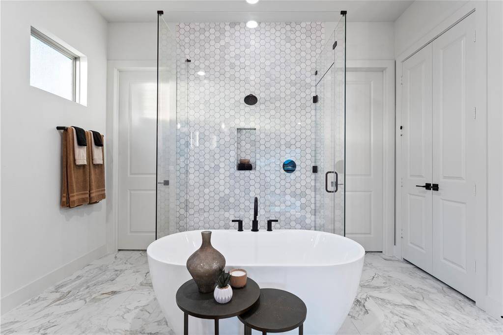 En-Suite Primary Bathroom with Freestanding Tub, Separate Shower,  and Linen Closet
