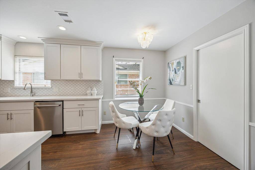 Breakfast nook in the kitchen and door with access to the utility room.