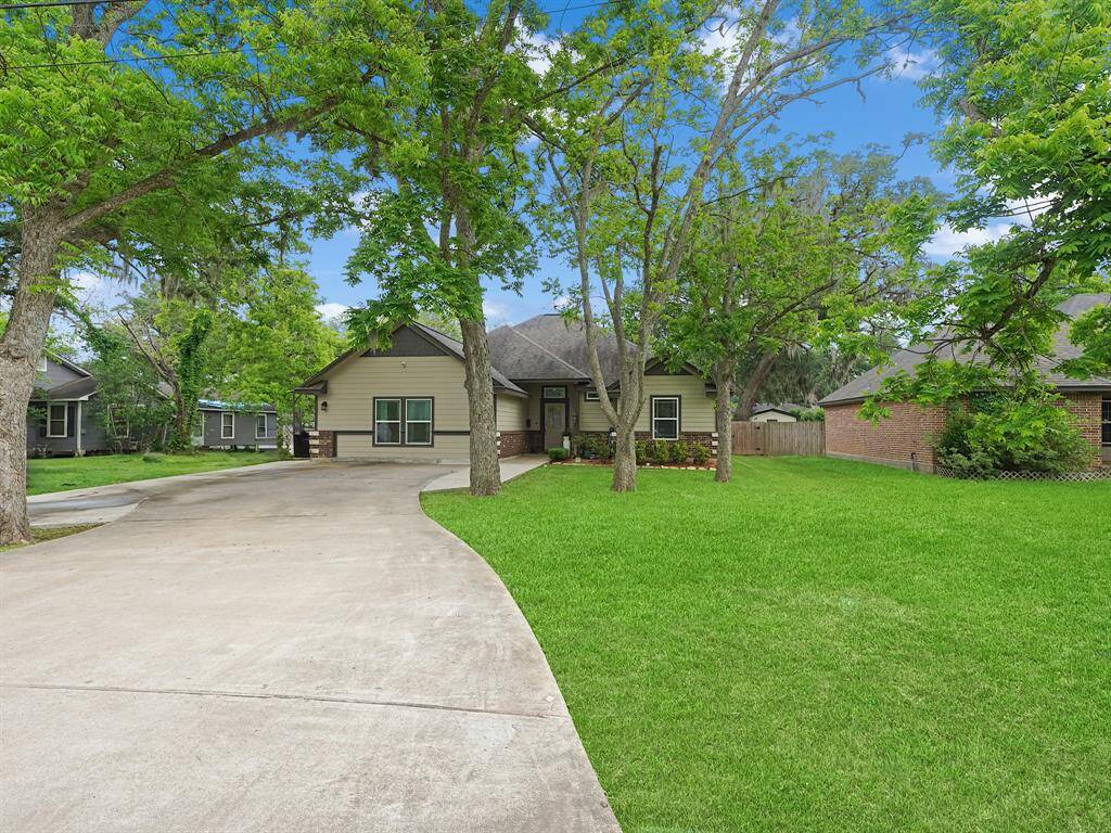 THIS GORGEOUS HOME IS SET BACK BEHIND SEVERAL PECAN TREES. EXTRA PARKING IS AVAILABLE ALONG THE LONG DRIVEWAY.