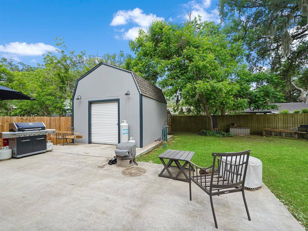 THE EXTENDED BACK PATIO IS PERFECT FOR ENTERTAINING.  THE 14x14 (196 sq.ft.) STORAGE SHED/SHOP IS INCLUDED WITH THE HOME.