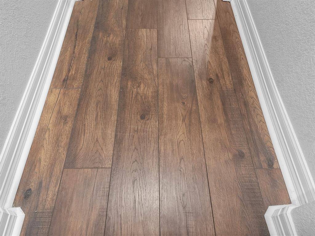 CLOSE UP OF THE GORGEOUS LUXURY LAMINATE FLOORING!
