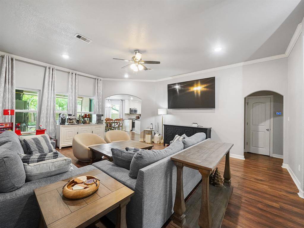 THIS ANGLE OF THE LIVING ROOM SHOWS THE KITCHEN TO LIVING ROOM OPEN CONCEPT FLOORPLAN.
