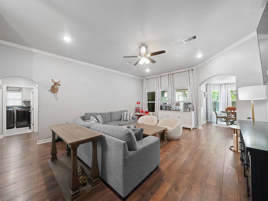 THIS ROOM OFFERS PLENTY OF SPACE FOR LOTS OF SEATING & ENTERTAINING.