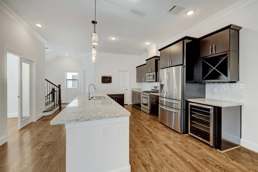 Unit comes with kitchen fridge, wine cooler, an extra fridge and an extra freezer.