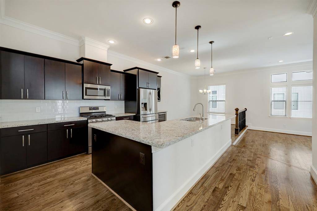 Open kitchen with dining area and living room.