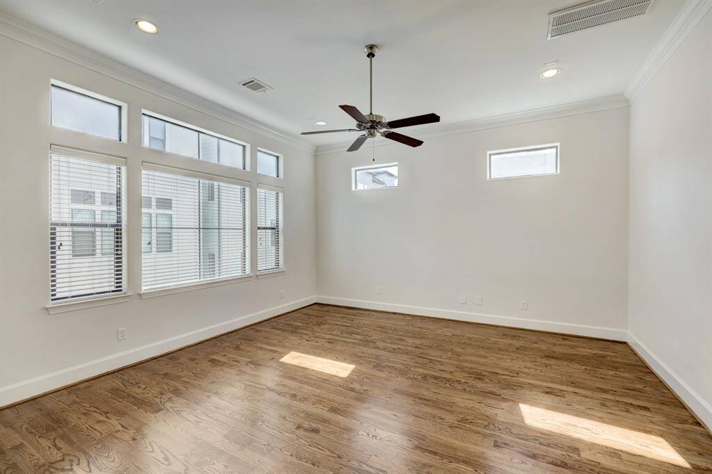 The living area is very spacious with great windows.