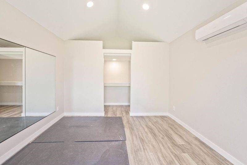 Storage shed built gym. Vinyl flooring, recess lighting with an AC unit.