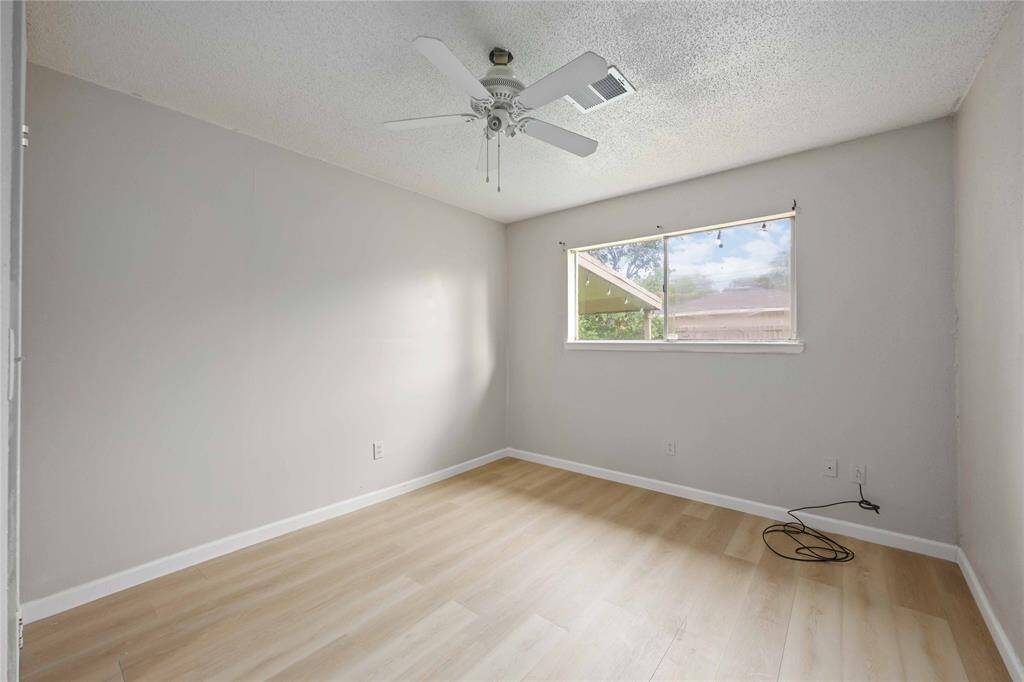 Staying in line, this bedroom has fresh paint and updated flooring