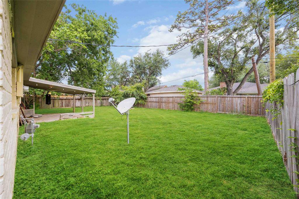 The large backyard has plenty of room to BBQ and spend time with friends and family.