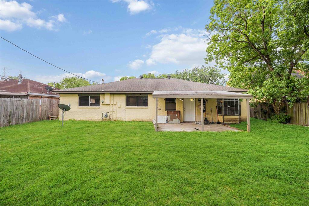 Cover patio in the large backyard is waiting for your personal touches.