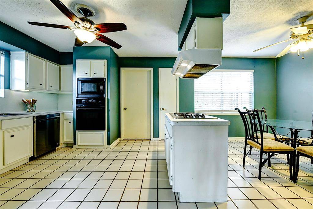 Kitchen has abundant storage and great counter space for meal prep.