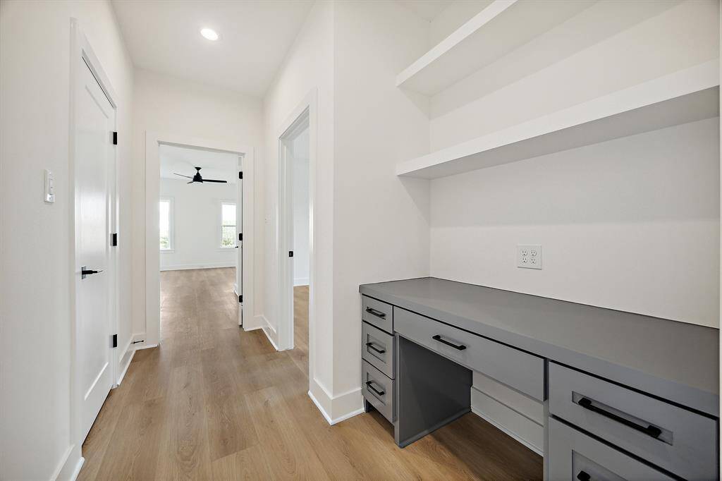 Dedicated second floor built-in desk with shelves, drawers and outlets