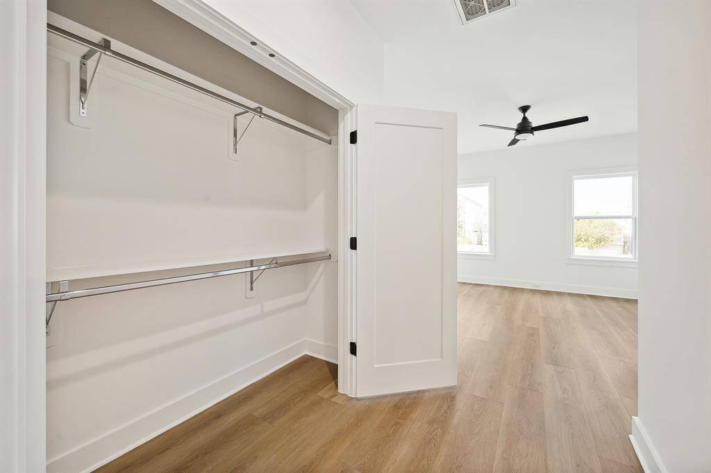 Spacious closet with double doors in second bedroom