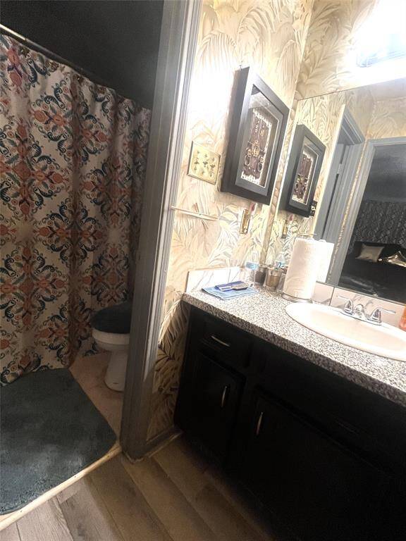 Primary bath with vanity area separated from toilet/bathtub room