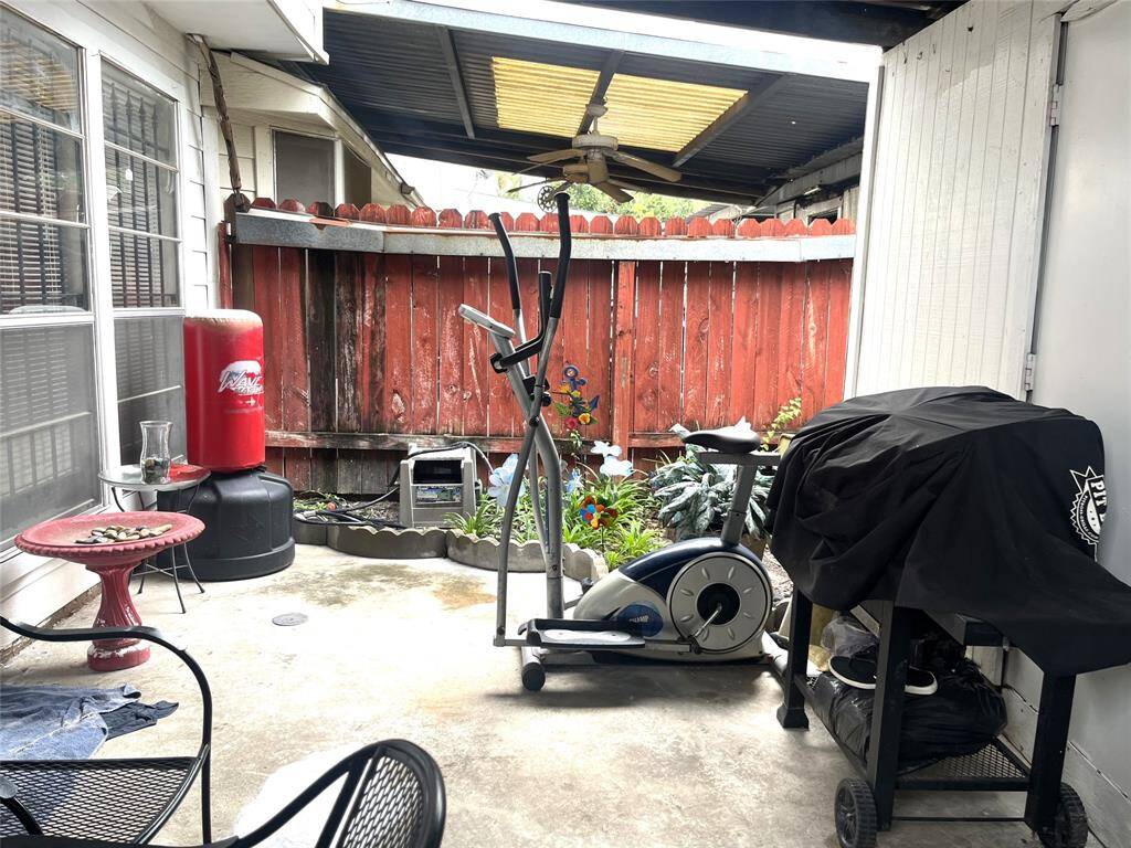 Enclosed private patio with storage closet at back entrance