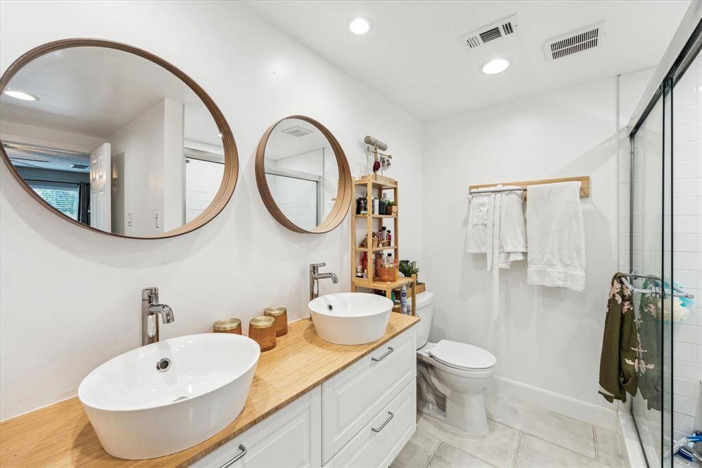 Fully renovated primary bathroom with modern finishes.