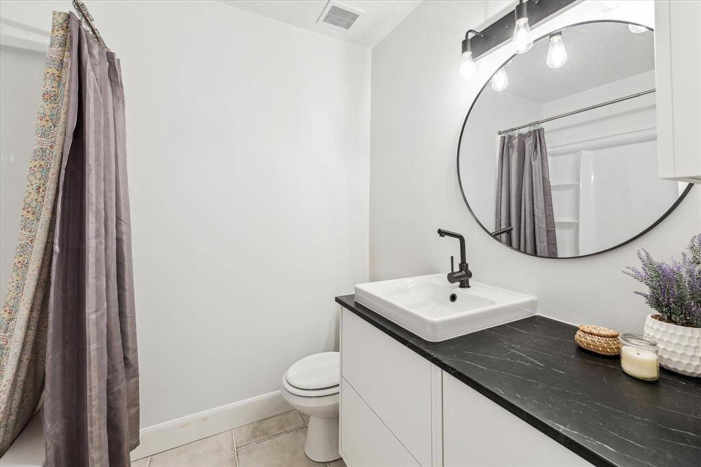 Fully renovated secondary bathroom on the 2nd floor with plenty of counter space and a shower/tub combo.