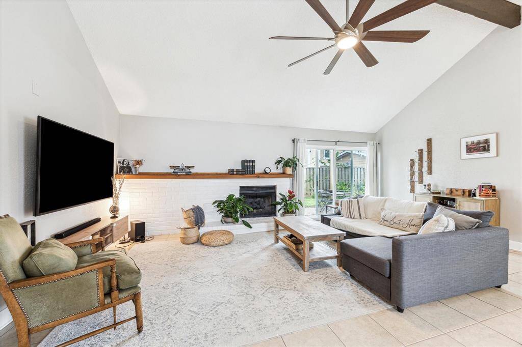 Formal living area with patio access through new sliding glass doors.