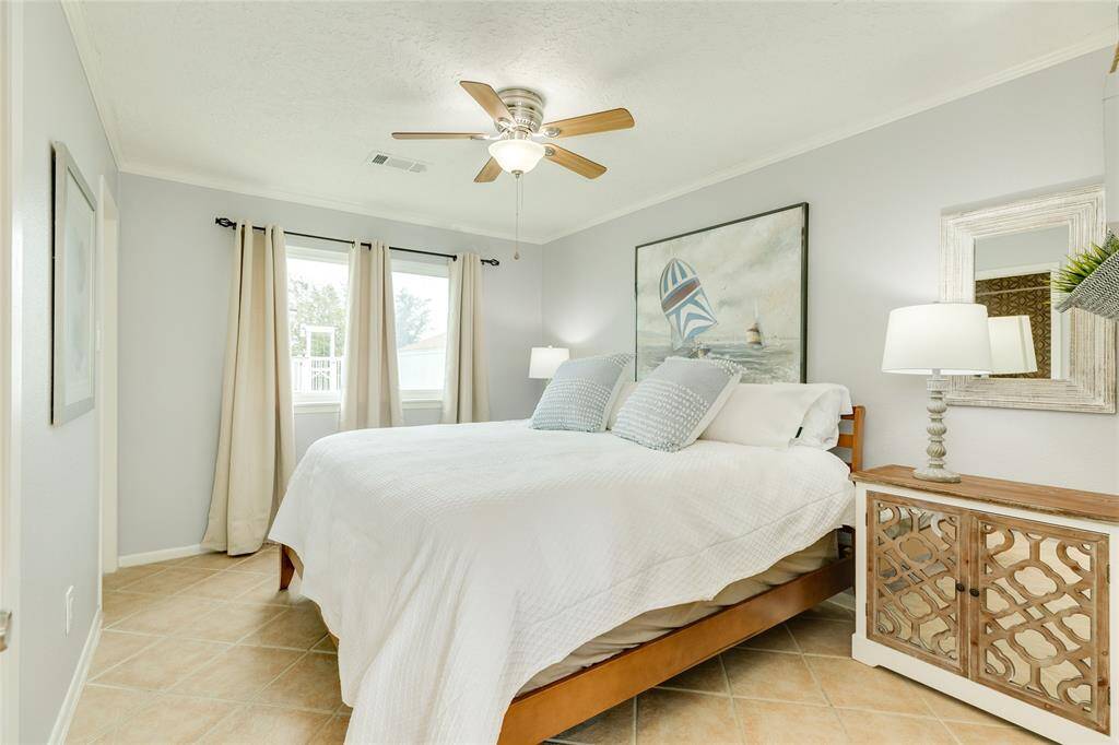 Tastefully decorated primary bedroom suite.