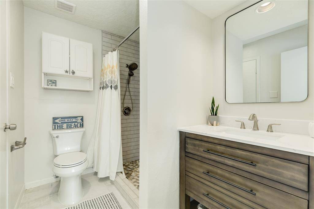 2nd bathroom with recent updates with large nicely tiled walk in shower.