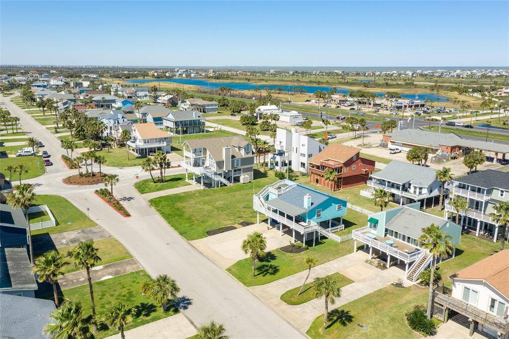 Aerial view of home facing north towards the bay.