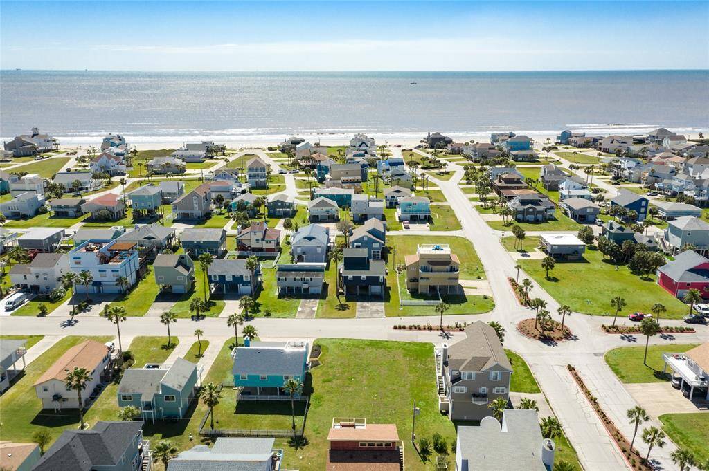 Aerial view of home facing south towards the beach.
