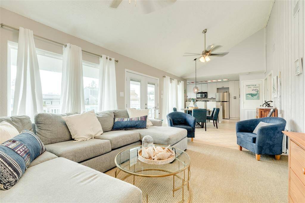 Living flowing to dining and kitchen.