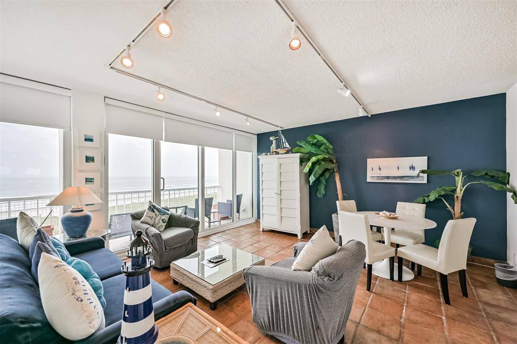 Living room with sofa and dining table.
