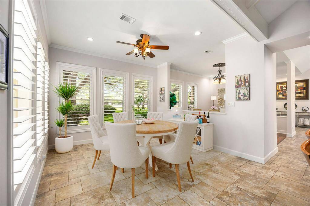 Start your day off right with a cup of coffee sitting with your family in the lovely breakfast area! Featuring large windows with shutters, custom neutral paint, tile flooring, recessed lighting and high ceilings. *Virtually Staged