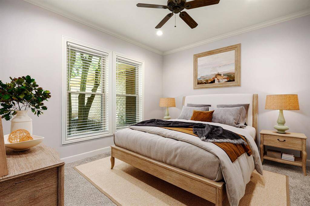 Secondary bedroom great for use as an in-law suite or guest suite features high ceilings, lovely modern ceiling fan, custom paint, plush carpet, space for seating area, direct access to the secondary bathroom and large window with privacy blinds. *Virtually Staged