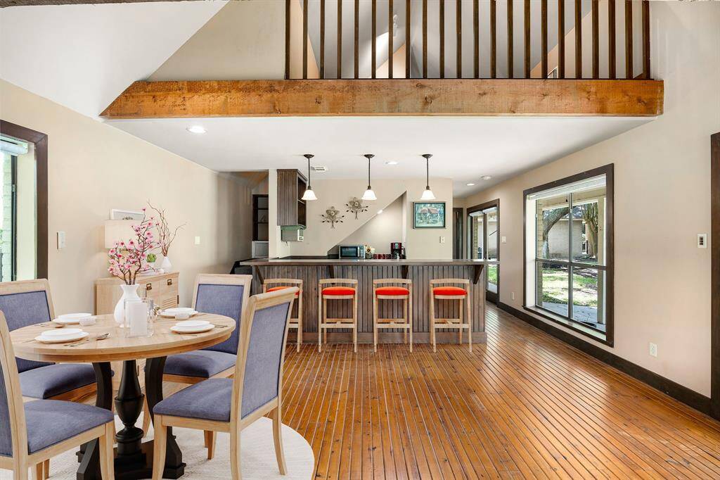 Charming and full of character, this guest house features a cozy breakfast nook with views of the upstairs loft balcony, adding an airy, open feel to the space. Whether you're enjoying a quiet morning coffee or taking in the unique architectural details, this inviting layout offers comfort and style at every turn. *Virtually Staged