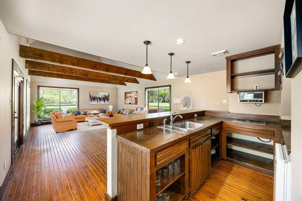 Designed with guests in mind, this kitchenette provides everything needed for a comfortable stay, compact cooking space, stylish finishes, and easy access to the rest of the guest house. *Virtually Staged