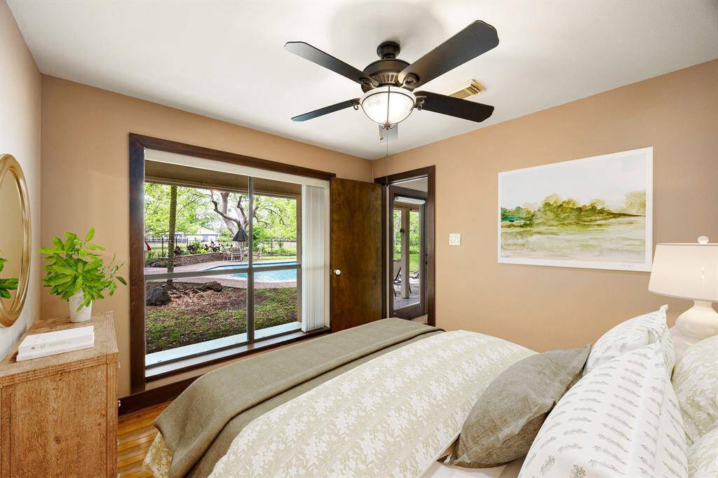 This well-lit guest bedroom features a cozy layout and a large window that brings in beautiful natural light—creating an ideal space for restful nights and bright mornings. *Virtually Staged