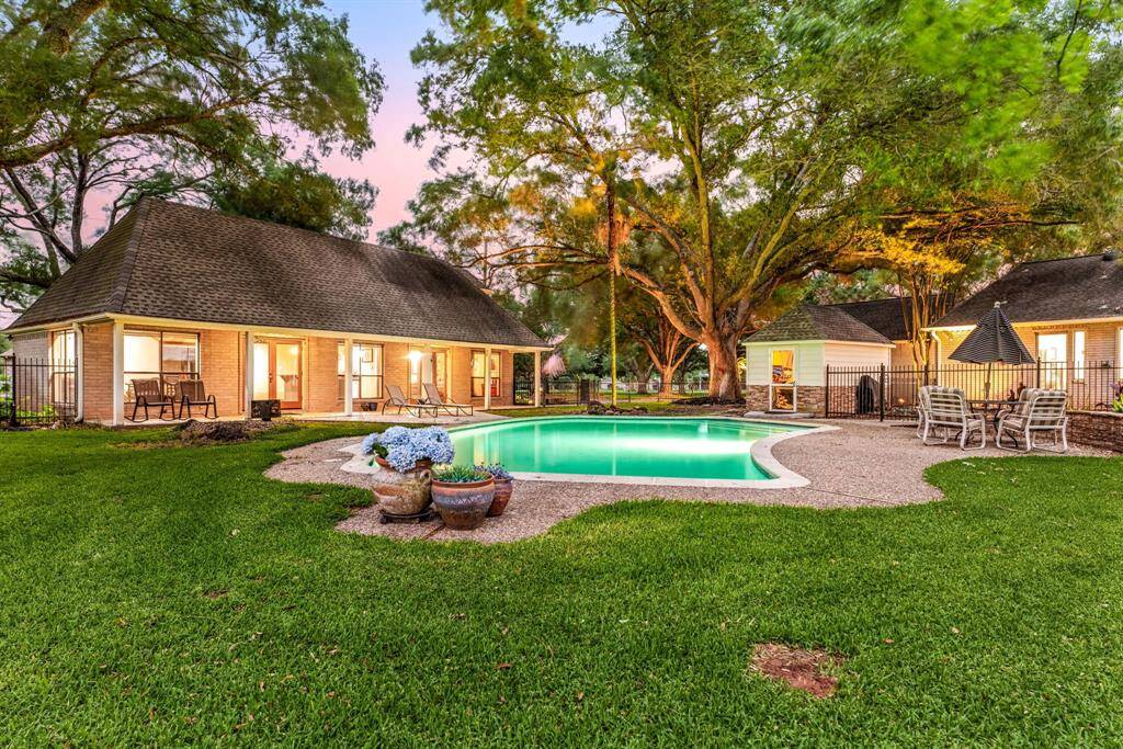 Welcome to your backyard paradise! This expansive outdoor space features lush greenery, a sparkling pool, and plenty of room to relax, entertain, or play. The perfect retreat for sunny days and starry nights.