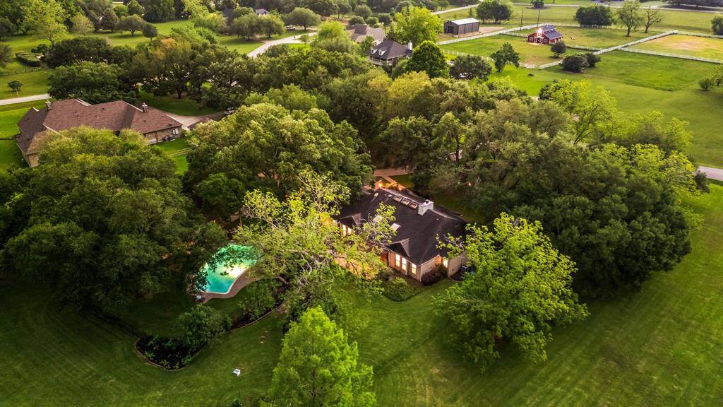 Breathtaking from above this stunning property spans 2.94 acres of natural beauty, complete with a sparkling pool, mature oak trees, and wide-open space for privacy and play. A rare retreat that combines peaceful country living with timeless charm.