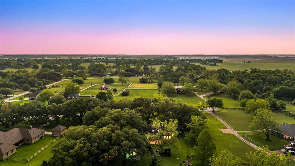 Nestled among majestic oak trees on nearly 3 acres, this exceptional property showcases a private pool and expansive grounds offering the perfect blend of luxury, nature, and tranquility.