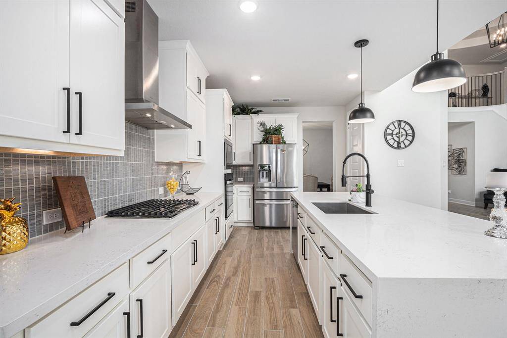 Ample cabinet space and a walk-in pantry.