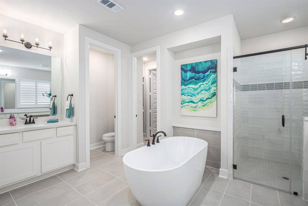Two separate sinks and a separate water closet.