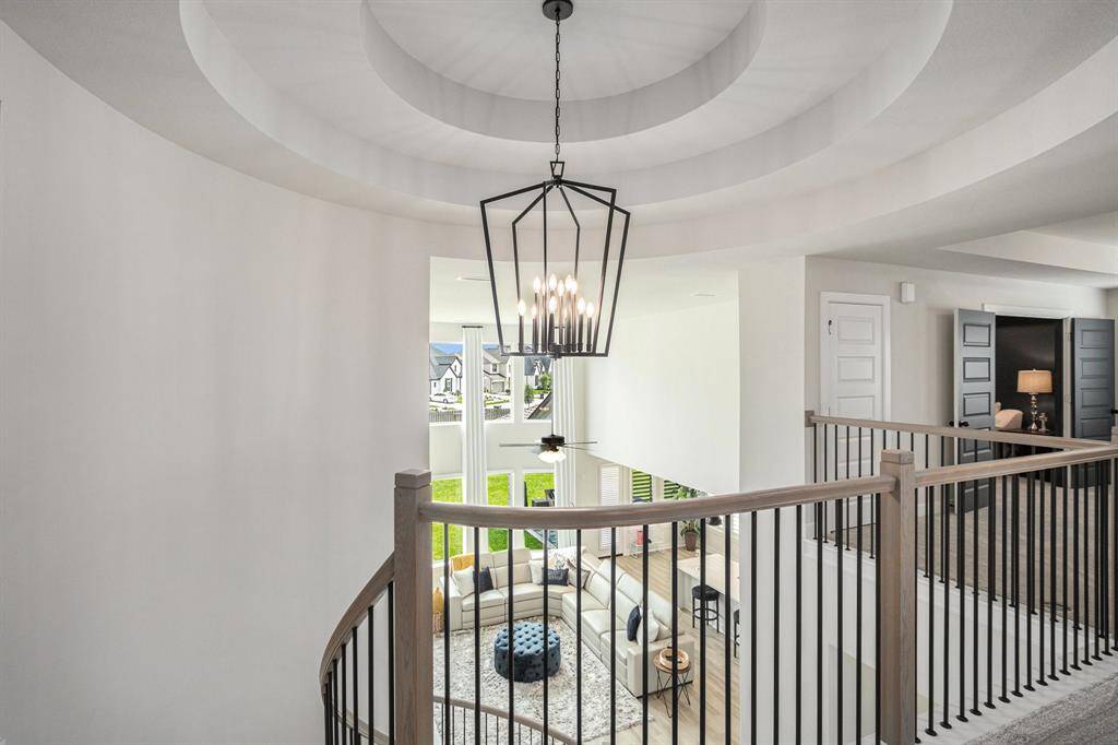 Open staircase beautifully connects downstairs and upstairs.