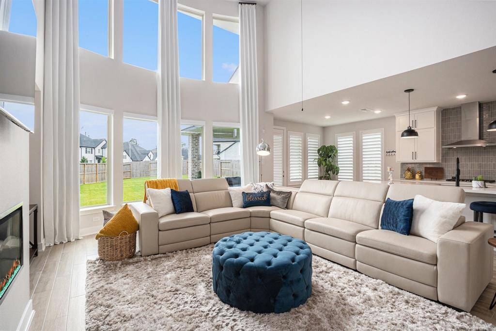 Living room is open to the kitchen, perfect for entertaining.