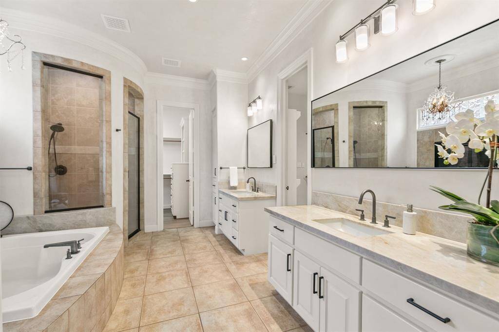 Such a lovely primary bath!  Plenty of storage and counter space.