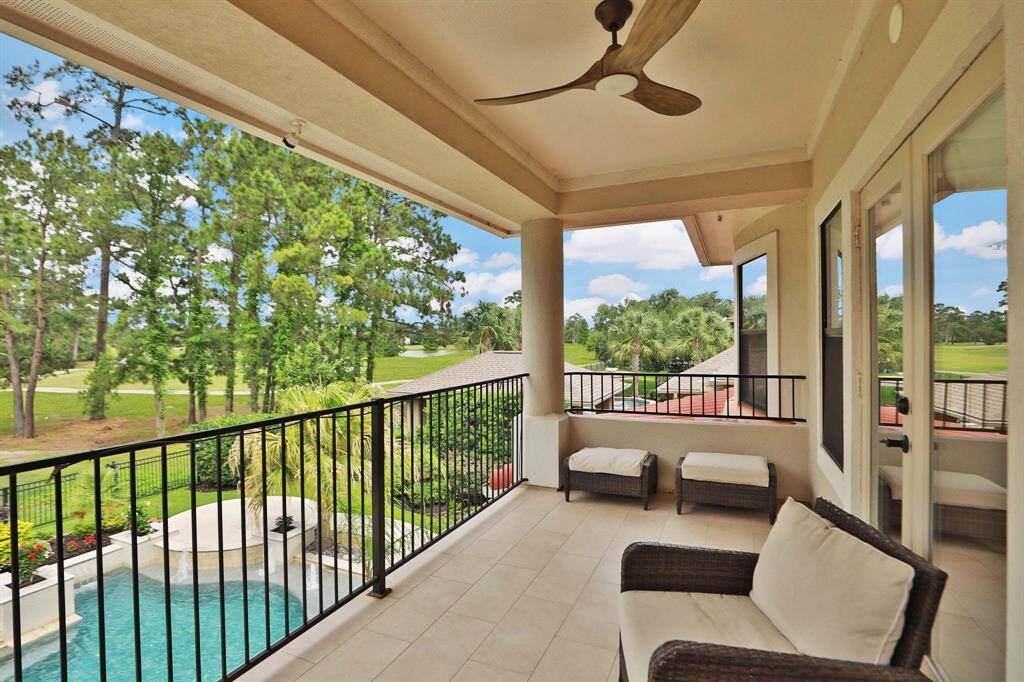 Through the game room is a door leading to the 16' x 8' balcony overlooking the 12th green and backyard pool.