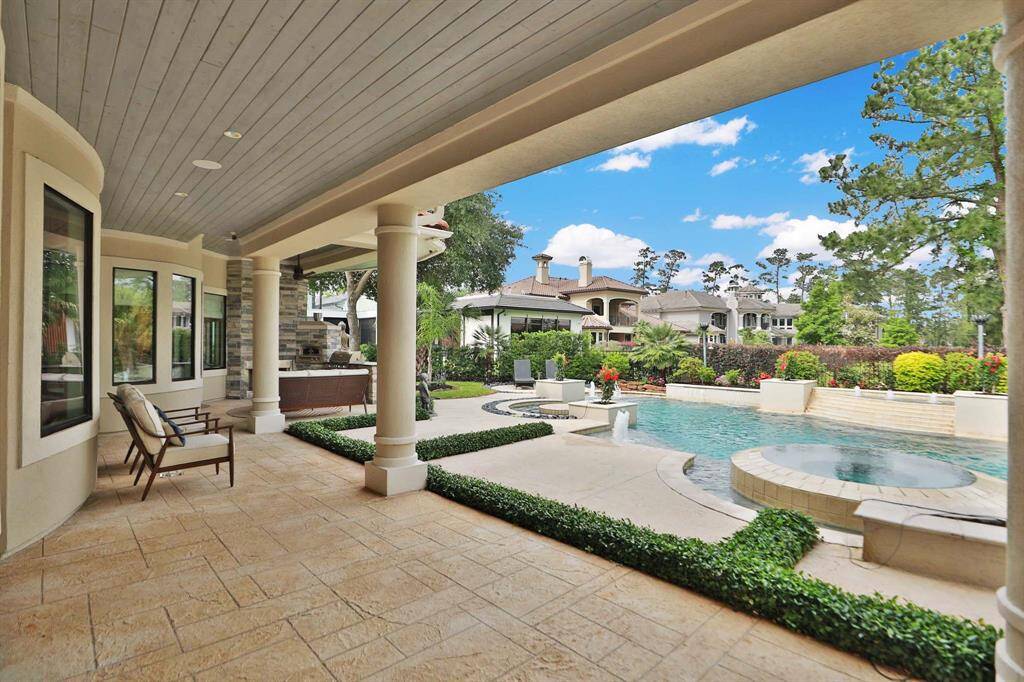 Another covered patio for entertaining. The primary bedroom has a door leading to this area.