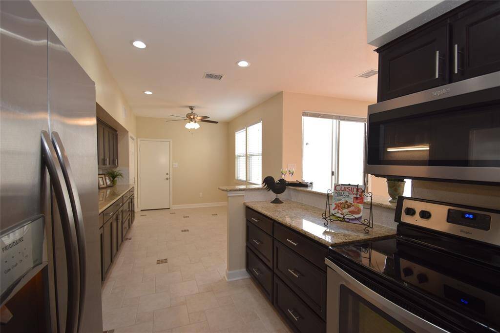 Kitchen opening to the breakfast room.