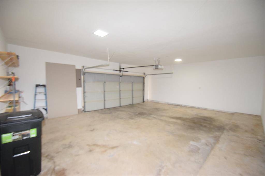 Large two car garage with storage area.
