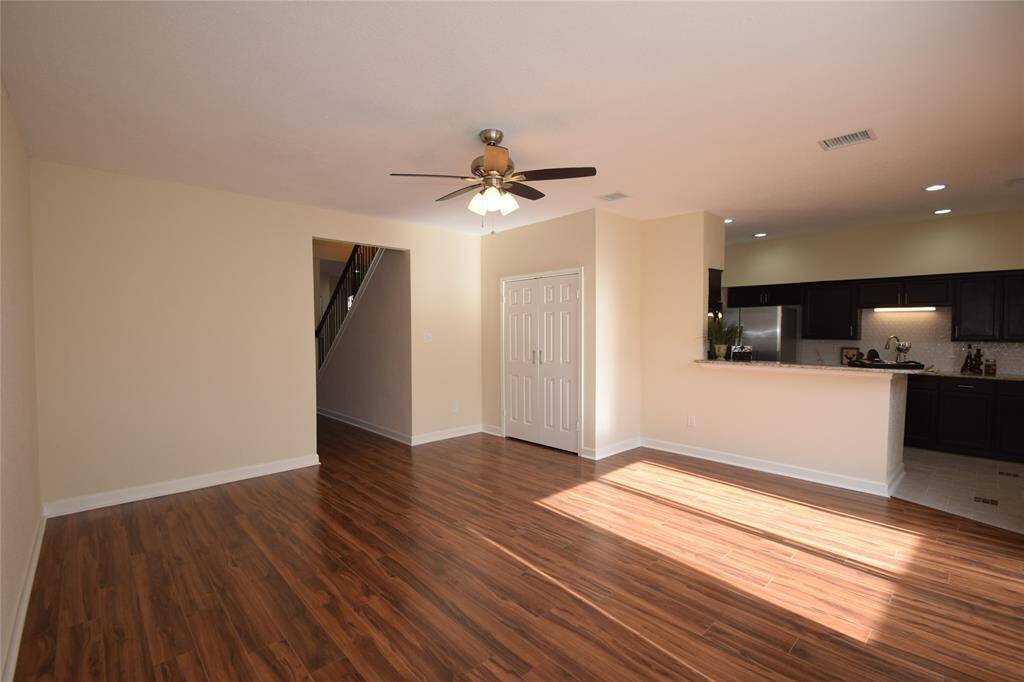 Enjoy another family room view showing the breakfast bar opening to the kitchen.